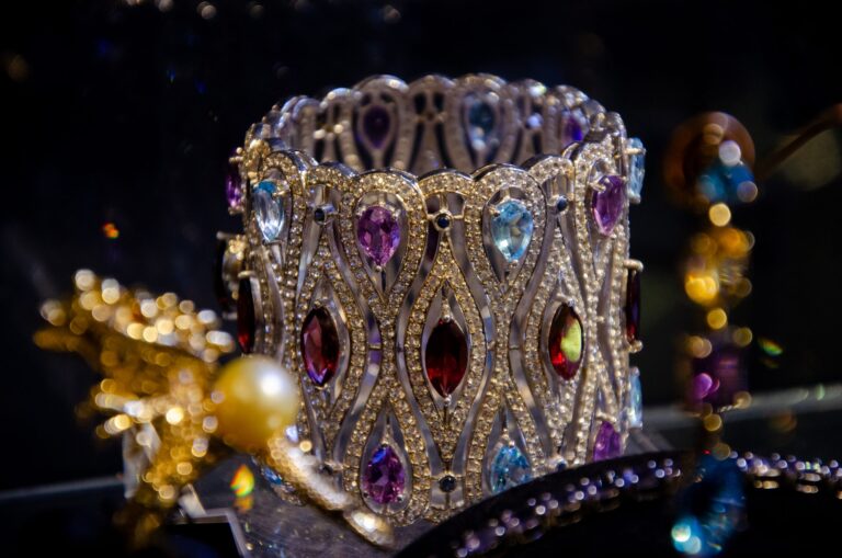 Wide jeweled cuff set with colored gemstones