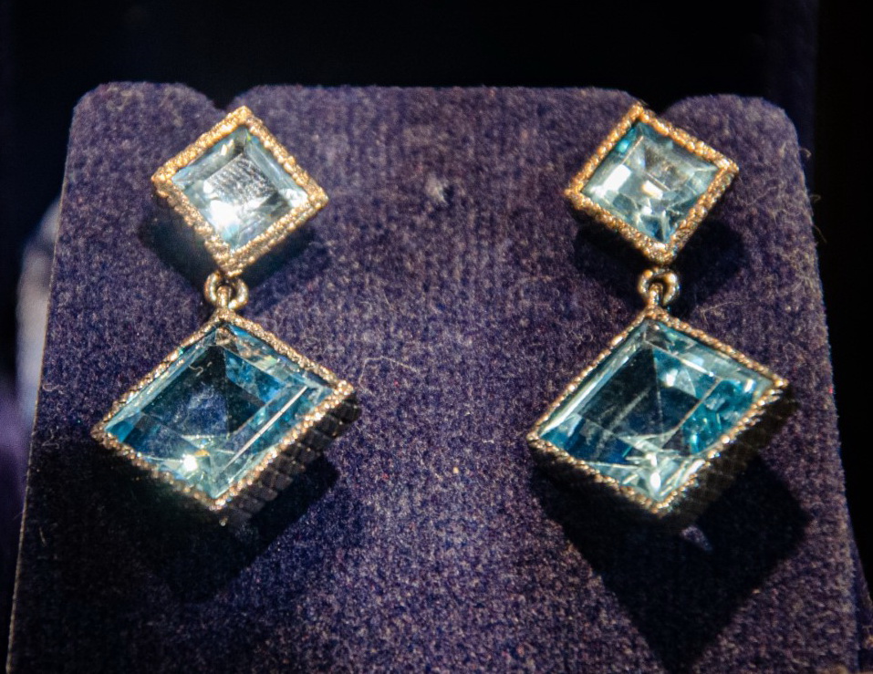 Geometric earrings with square and diamond-shaped pale blue stones